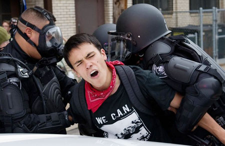 Police detain a demonstrator during anti G20 protests in Pittsburgh, Pennsylvania, September 24, 2009